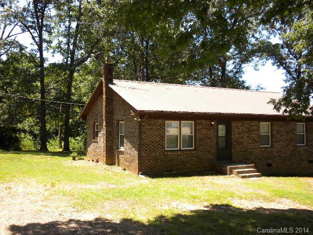 6918 Medlin Road Monroe, NC 28112 - Photo 10 of 11 a view of a house with a yard