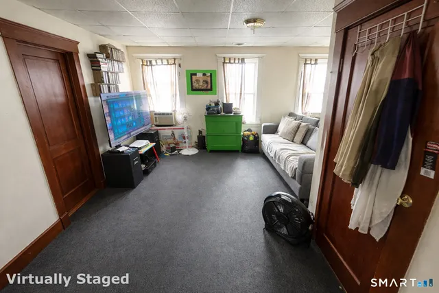 a view of a backyard with wooden fence