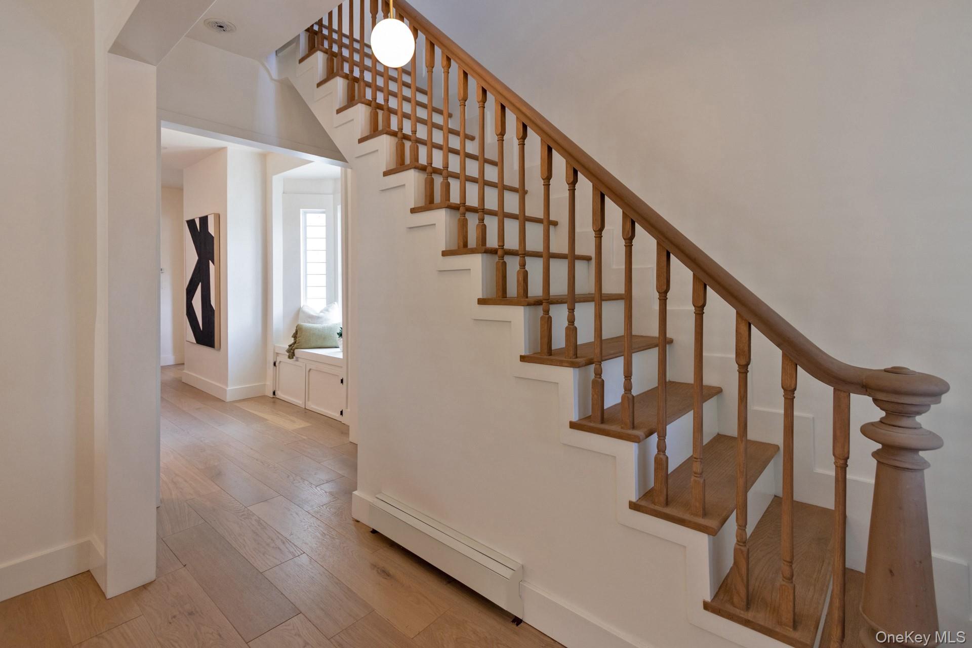 114 Rombout Avenue Beacon, NY 12508 - Photo 8 of 32 Traditional wood staircase with turned balusters and a decorative newel post