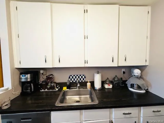 a kitchen with a sink and cabinets