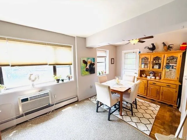 a room with furniture a rug and a window