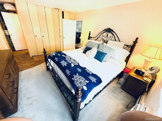 a bedroom with bed and a window