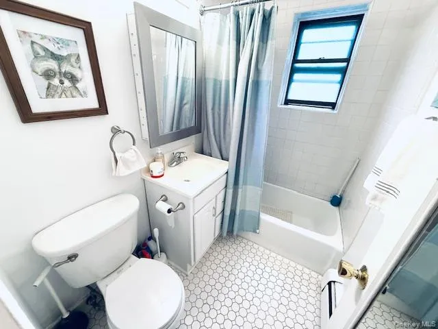 a bathroom with a sink toilet and tub
