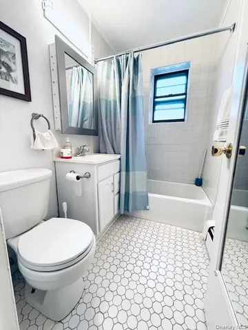 a bathroom with a toilet a sink and a bathtub