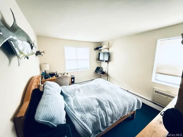 a bed room with a bed and a window