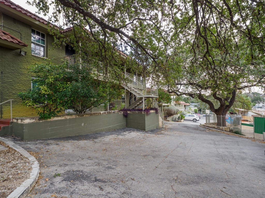 2302 East Side Drive, Unit 28 Austin, TX 78704 - Photo 2 of 16 a view of a house with a yard and tree