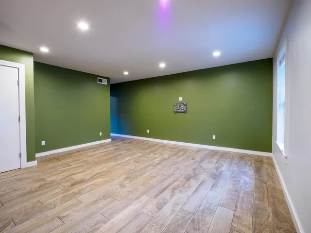 a view of room with wooden floor