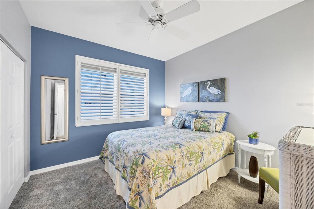 13113 Gasparilla Road, Unit 403 Placida, FL 33946 - Photo 29 of 62 a bedroom with a bed and a window