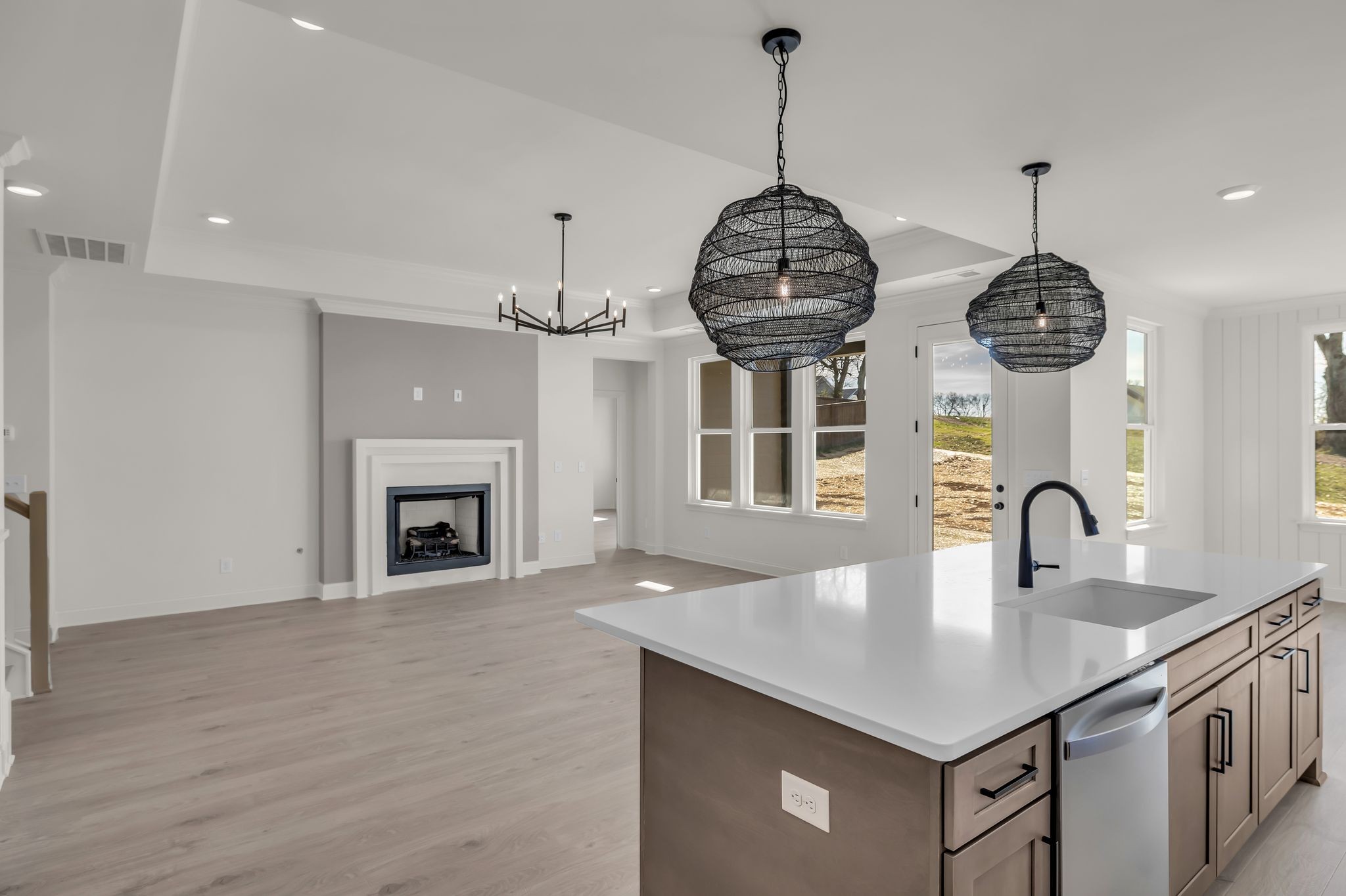 207 Phillips Bend Spring Hill, TN 37174 - Photo 12 of 55 a kitchen with stainless steel appliances granite countertop a sink a kitchen island a stove and a wooden floor