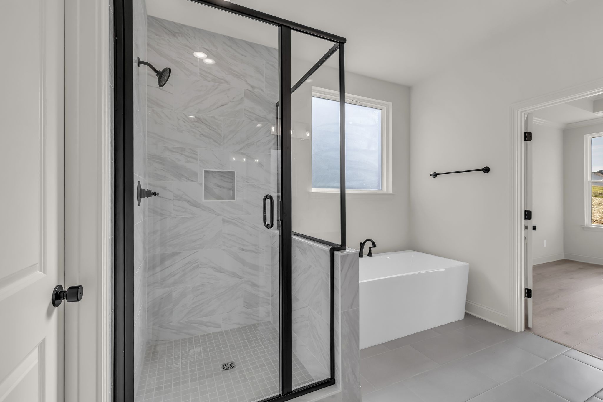 207 Phillips Bend Spring Hill, TN 37174 - Photo 24 of 55 a bathroom with a tub a mirror and a shower