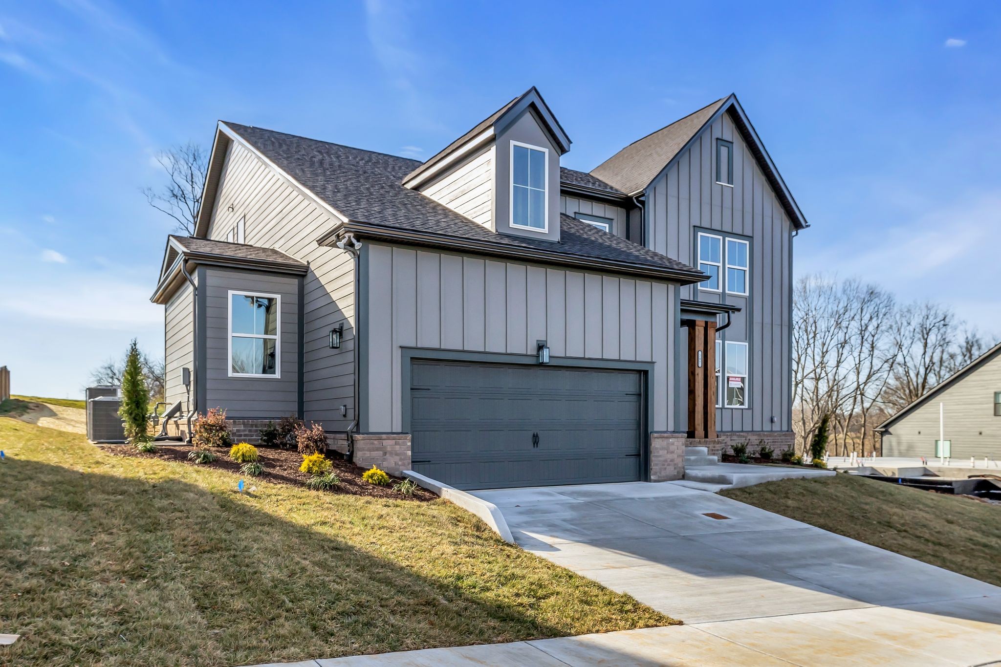 207 Phillips Bend Spring Hill, TN 37174 - Photo 3 of 55 a view of a house with a yard and garage