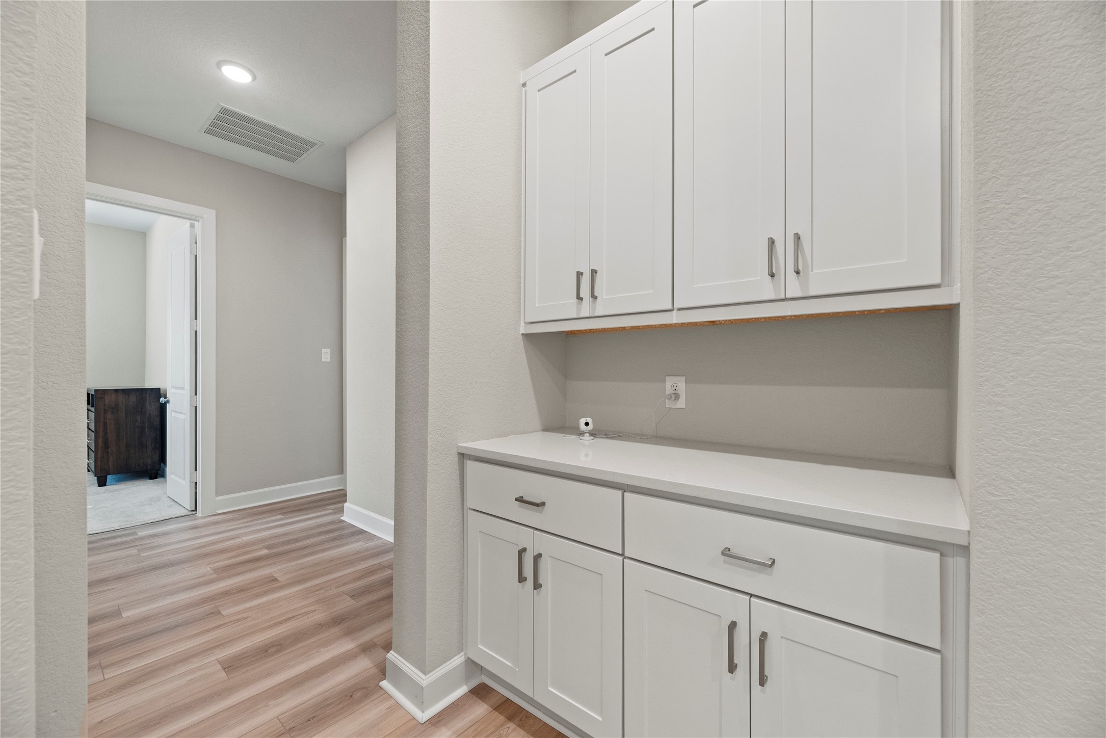 3111 Swift Way Katy, TX 77493 - Photo 12 of 50 a view of cabinets and wooden floor