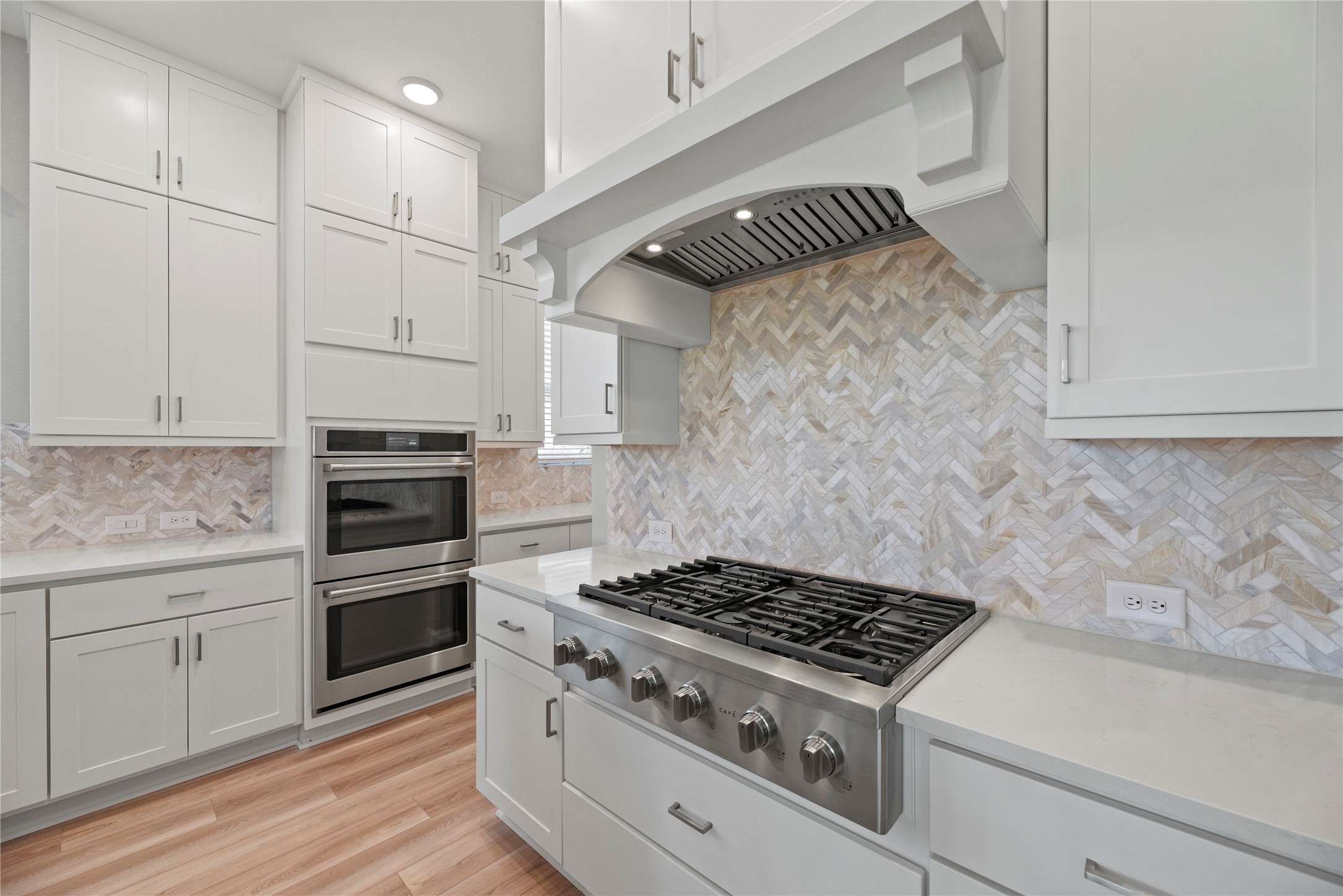 3111 Swift Way Katy, TX 77493 - Photo 26 of 50 a kitchen with granite countertop white cabinets and appliances