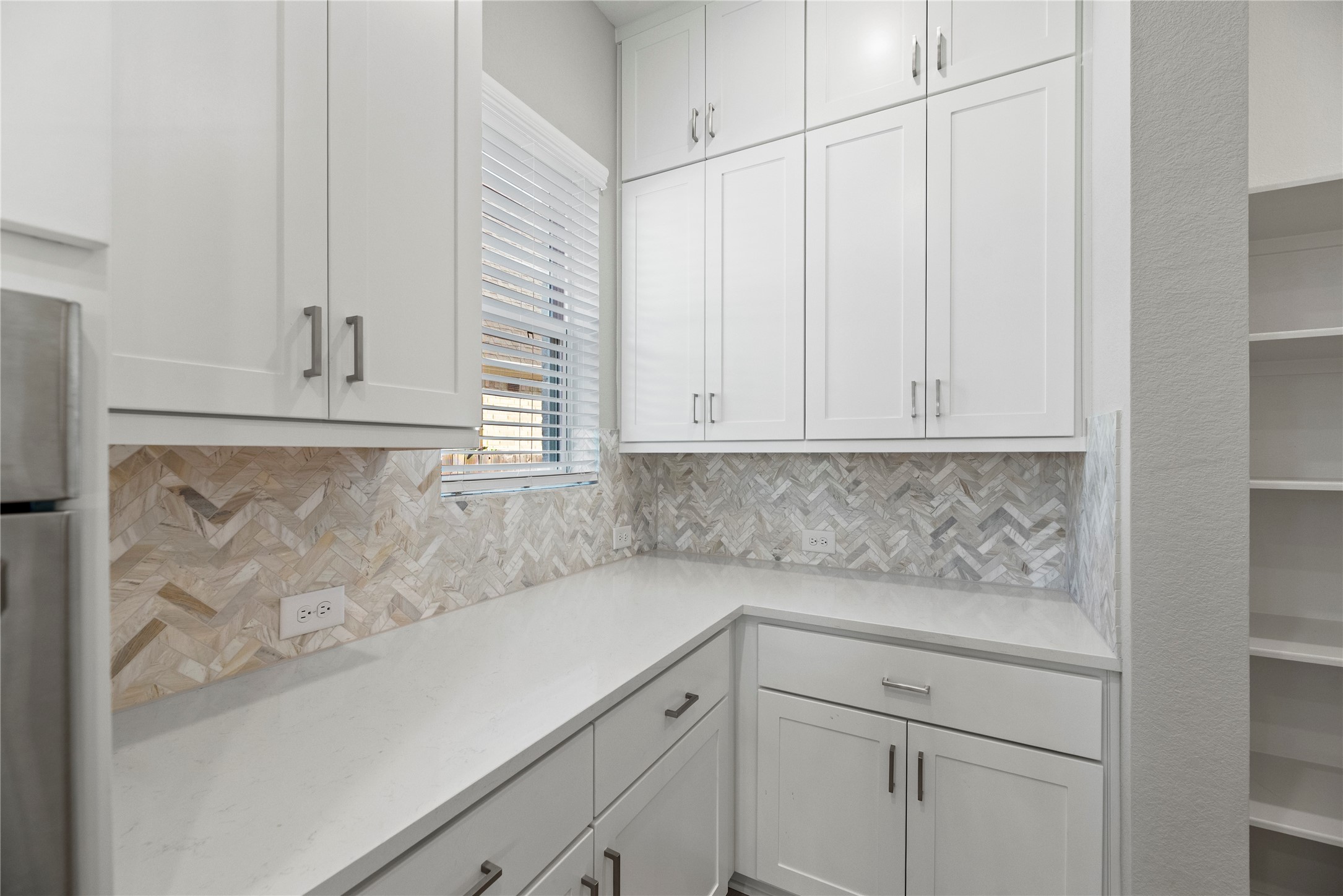 3111 Swift Way Katy, TX 77493 - Photo 28 of 50 a kitchen with white cabinets and sink