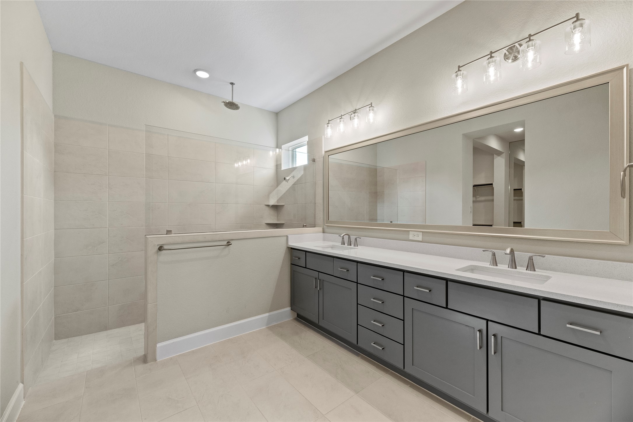 3111 Swift Way Katy, TX 77493 - Photo 39 of 50 a bathroom with a double vanity sink and mirror