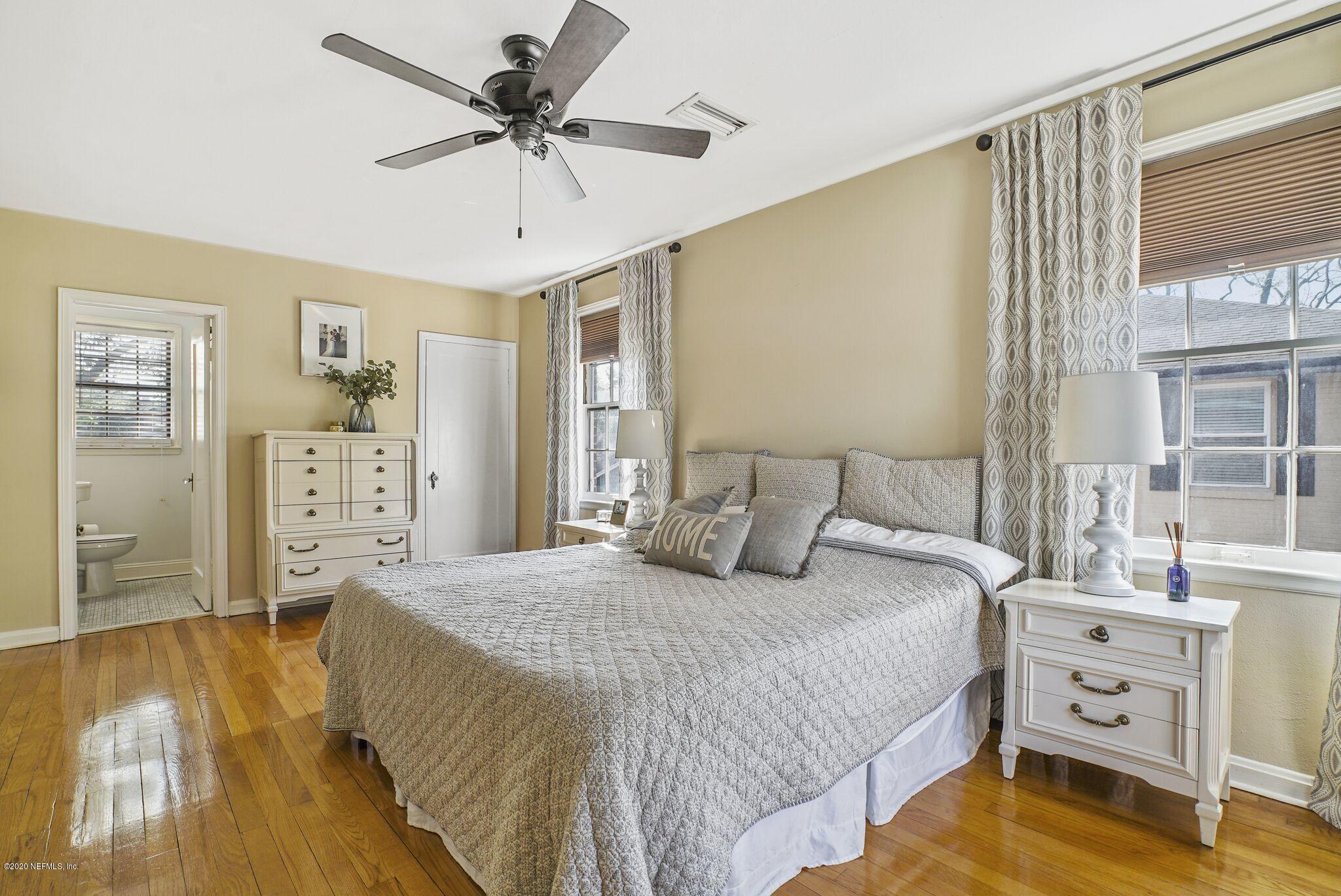 2104 Huntsford Road Jacksonville, FL 32207 - Photo 18 of 30 a bedroom with a bed and a table