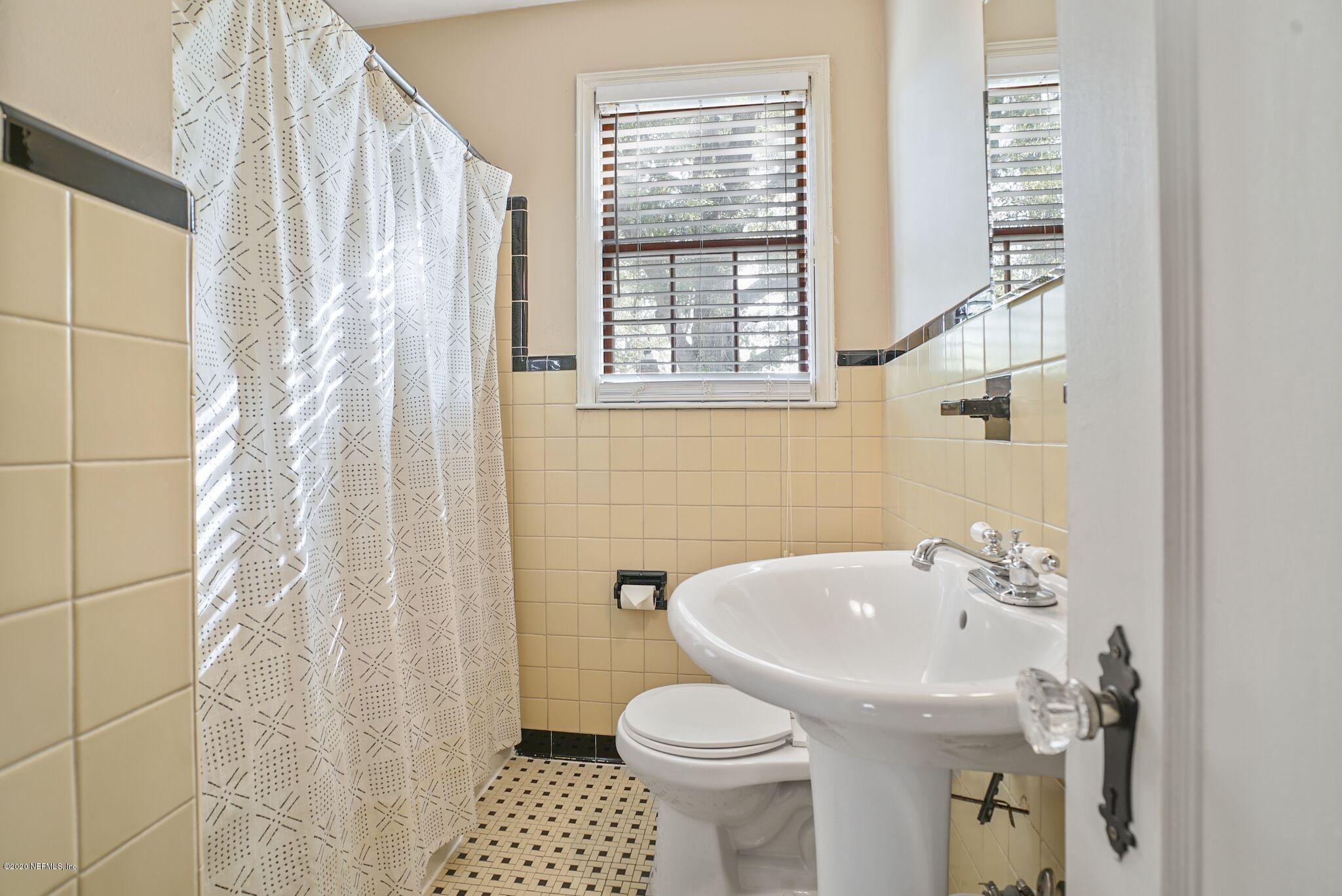 2104 Huntsford Road Jacksonville, FL 32207 - Photo 25 of 30 a bathroom with a sink toilet and shower