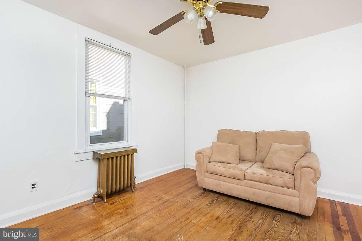 4604 Schenley Road Baltimore, MD 21210 - Photo 18 of 30 a living room with furniture and a window