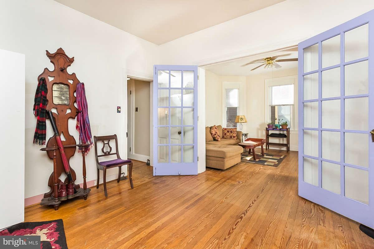 4604 Schenley Road Baltimore, MD 21210 - Photo 3 of 30 a living room with furniture and a wooden floor