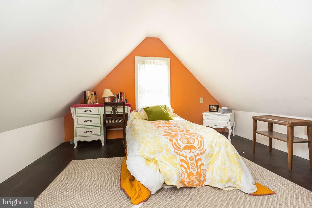 4604 Schenley Road Baltimore, MD 21210 - Photo 22 of 30 a bed sitting in a bedroom next to a window