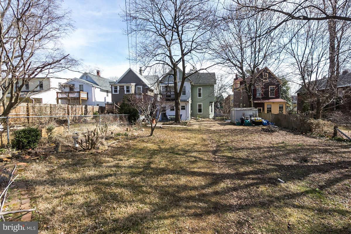 4604 Schenley Road Baltimore, MD 21210 - Photo 27 of 30 a view of a white house with a yard covered in snow