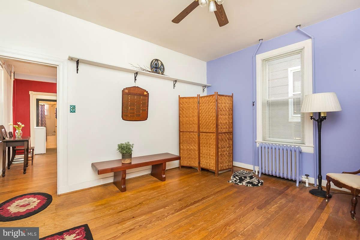 4604 Schenley Road Baltimore, MD 21210 - Photo 6 of 30 a view of a room with wooden floor and furniture