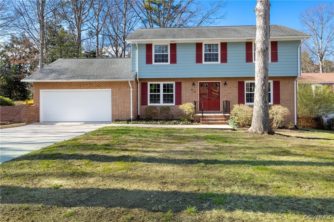 4008 Belspring Road Chester, VA 23831 - Photo 1 of 35 a front view of a house with garden