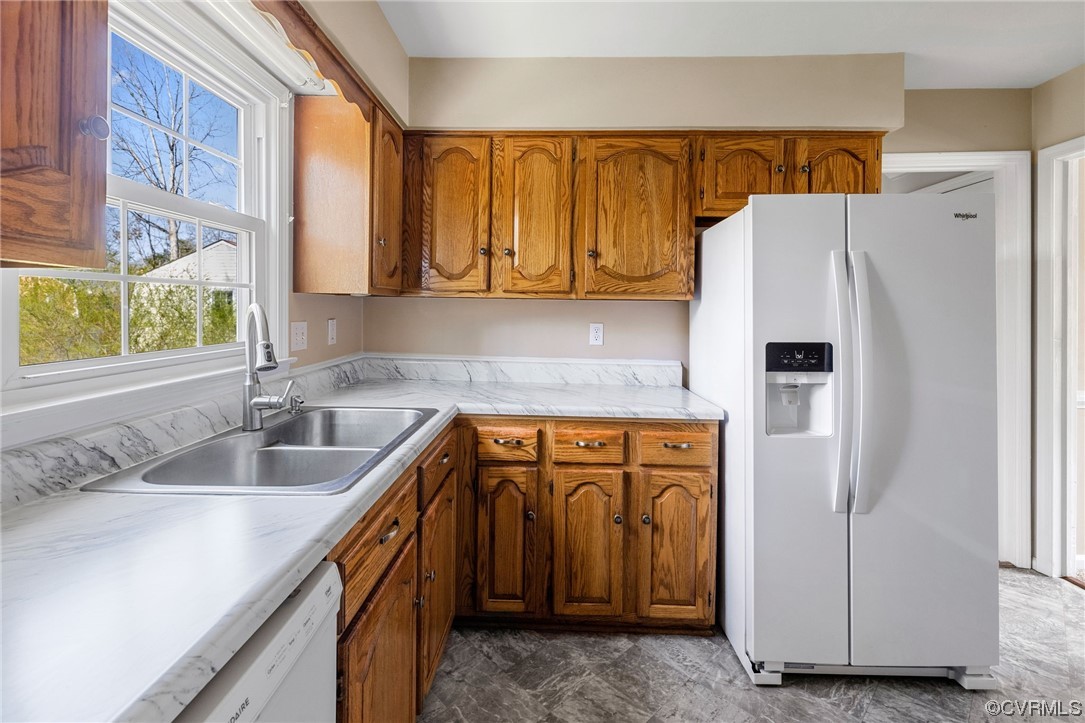 4008 Belspring Road Chester, VA 23831 - Photo 10 of 35 a kitchen with stainless steel appliances granite countertop a refrigerator and a sink