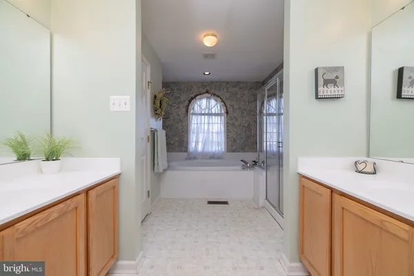 a bathroom with a sink a vanity and a mirror