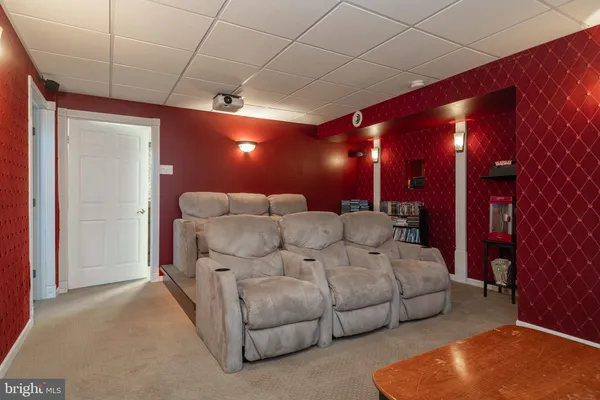 a spacious bedroom with a bed and a night stand