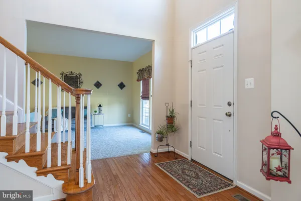 a view of entryway with wooden floor