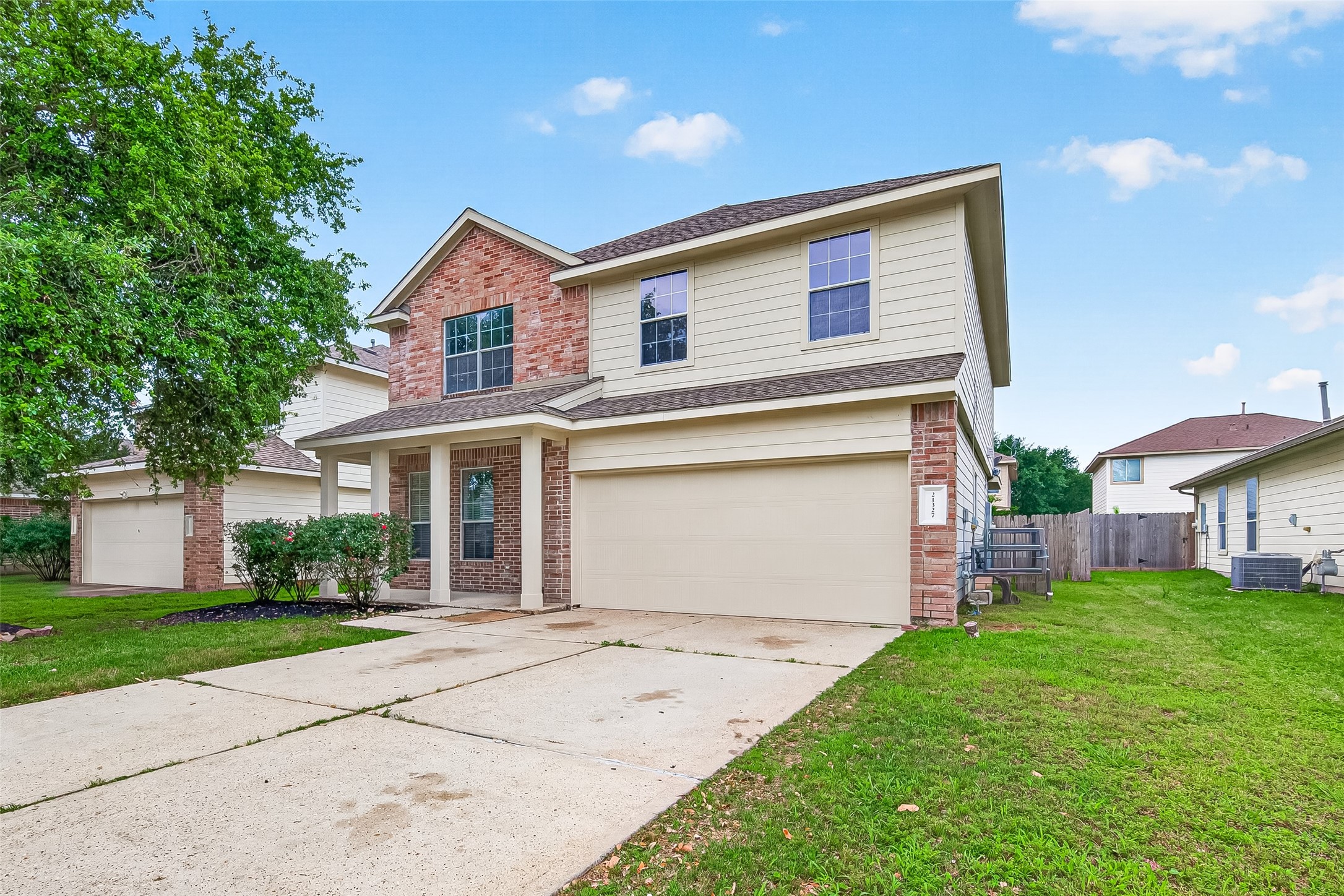 21327 Bella Flora Court Spring, TX 77379 - Photo 2 of 50 a view of a house with a yard