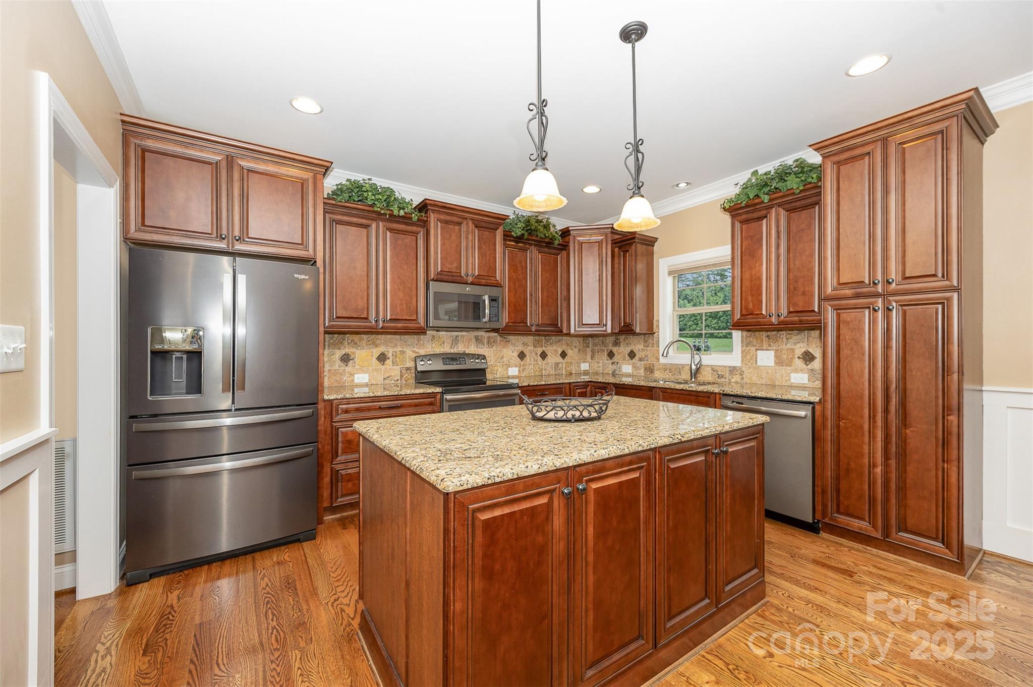 375 Pebblestone Court Lexington, NC 27295 - Photo 12 of 34 a kitchen with a refrigerator a sink and cabinets