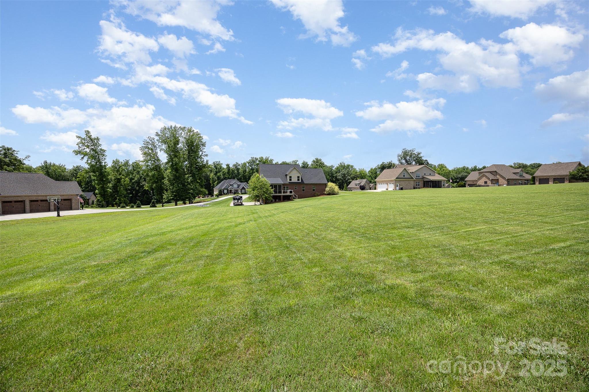 375 Pebblestone Court Lexington, NC 27295 - Photo 32 of 34 a view of a green field and trees in the background