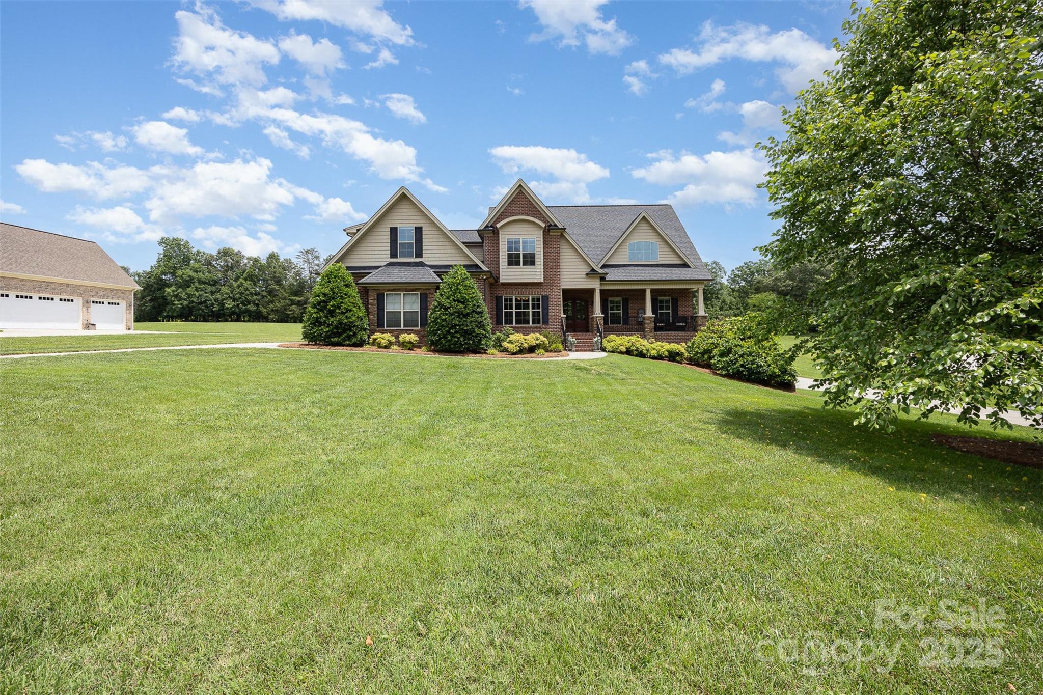 375 Pebblestone Court Lexington, NC 27295 - Photo 4 of 34 a front view of a house with a garden