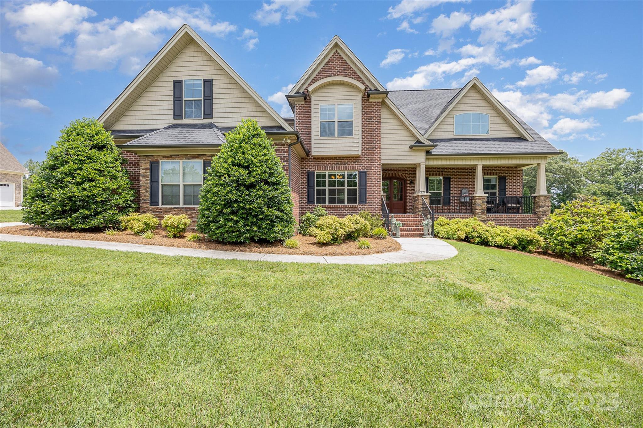 375 Pebblestone Court Lexington, NC 27295 - Photo 6 of 34 a front view of a house with a yard and garage