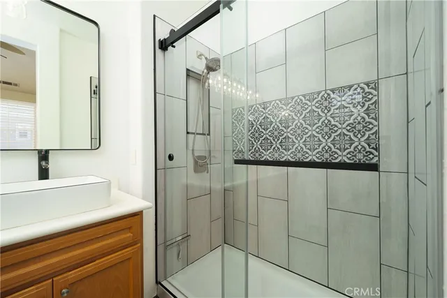 a bathroom with a shower and a sink