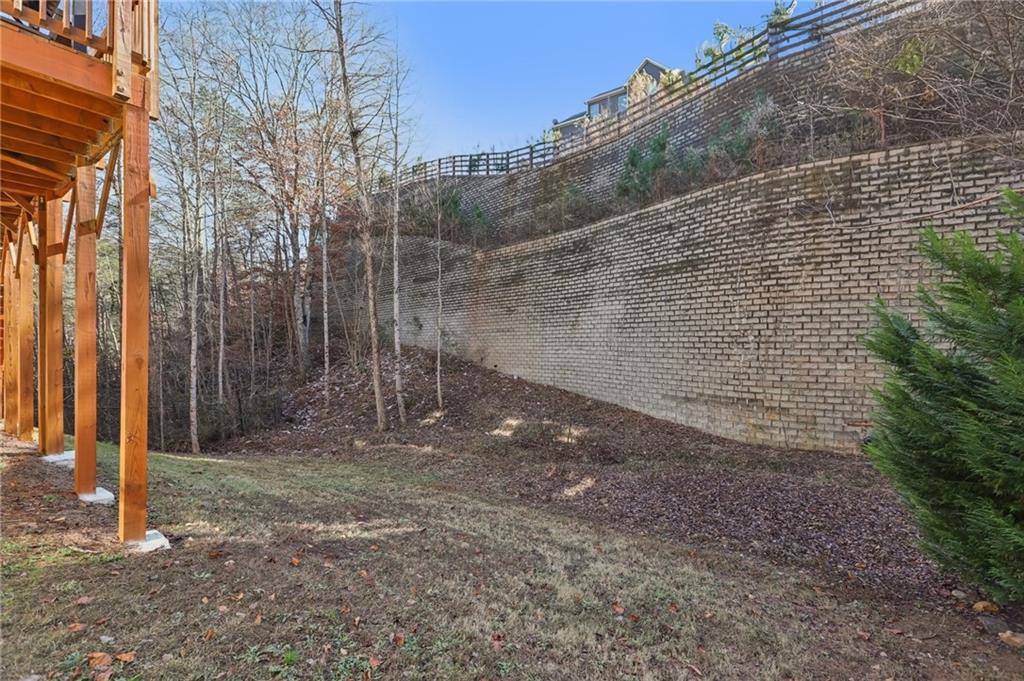 264 Creek View Place Canton, GA 30114 - Photo 26 of 32 a view of a yard with trees