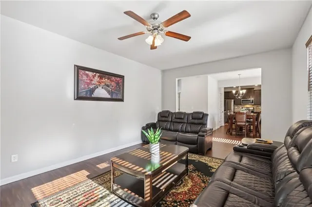 a living room with furniture and a rug