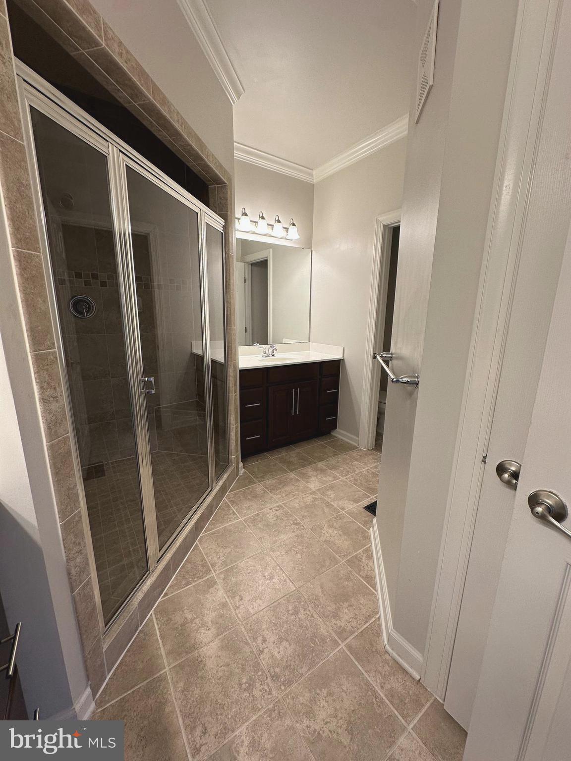 3606 Holborn Place Frederick, MD 21704 - Photo 21 of 30 a bathroom with a tub and a glass door