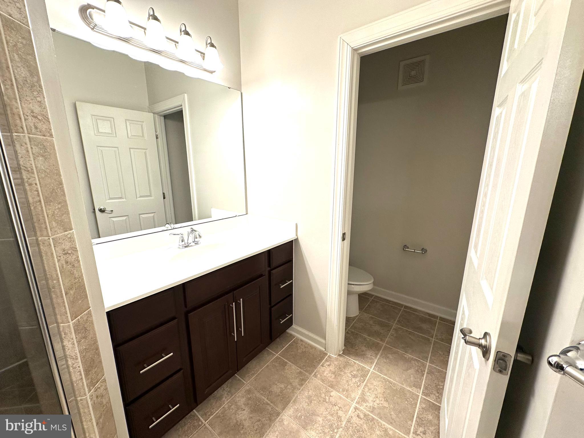 3606 Holborn Place Frederick, MD 21704 - Photo 22 of 30 a bathroom with a sink vanity and a mirror