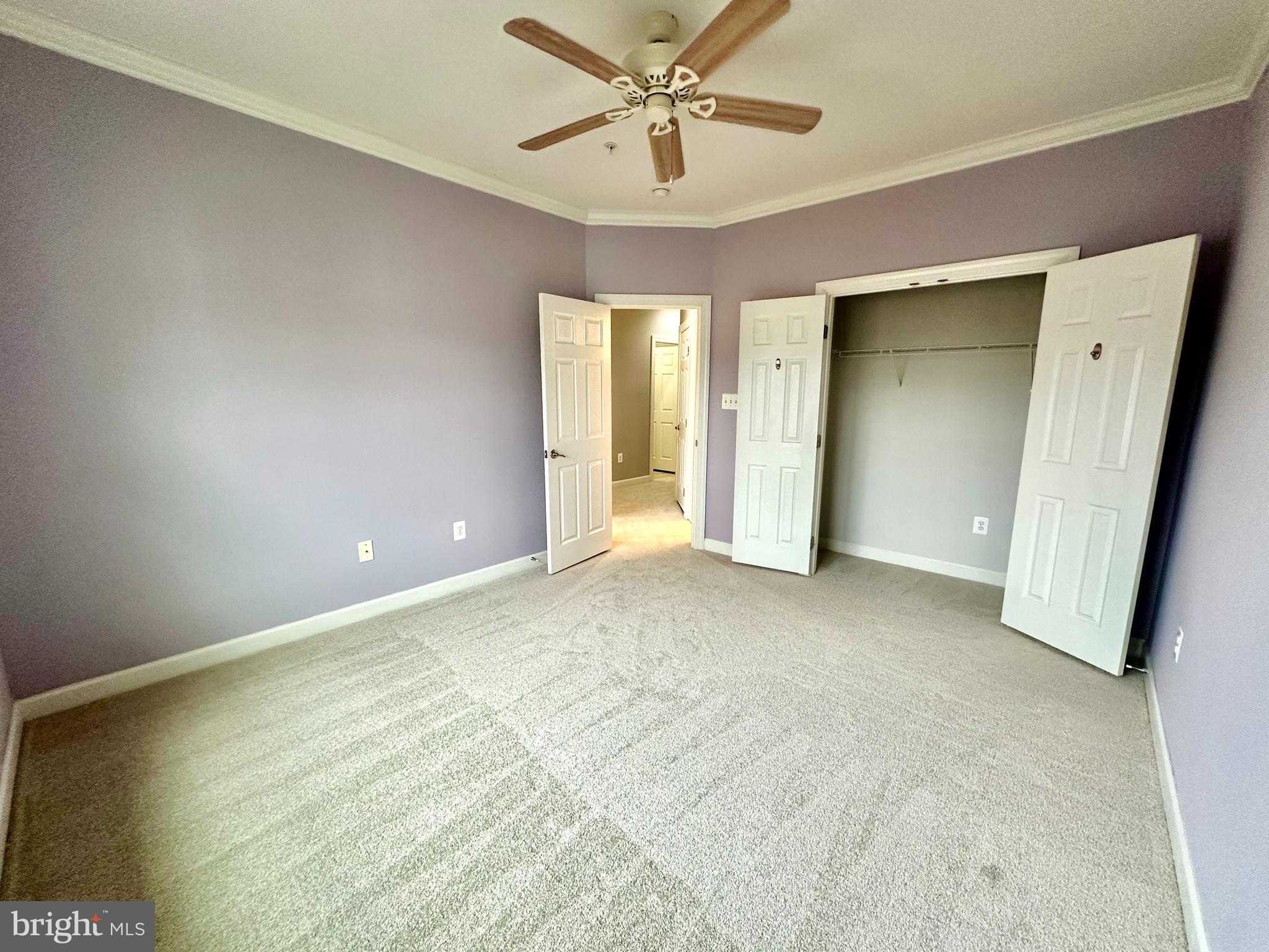 3606 Holborn Place Frederick, MD 21704 - Photo 25 of 30 an empty room with closet and a ceiling fan