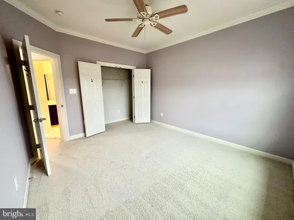 an empty room with windows and entrance