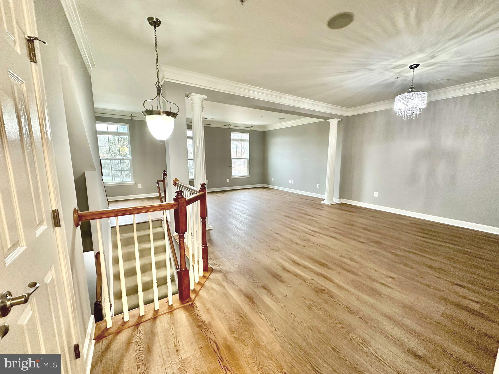 3606 Holborn Place Frederick, MD 21704 - Photo 5 of 30 a view of a room with wooden floor and staircase