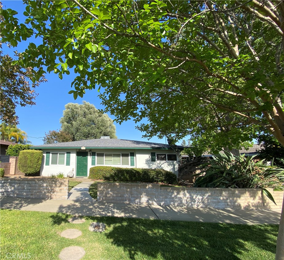 7275 Hellman Avenue Rancho Cucamonga, CA 91701 - Photo 1 of 1 a front view of a house with garden