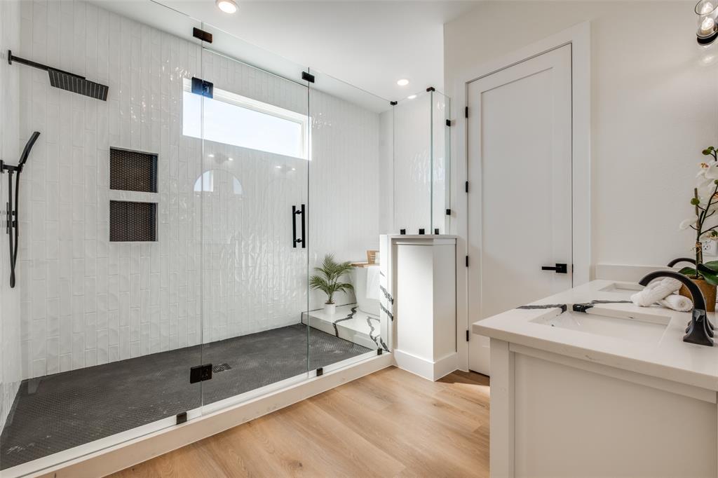 2424 Jeffries Street Dallas, TX 75215 - Photo 12 of 28 Full bathroom with double vanity, a shower stall, light wood-style floors, and recessed lighting