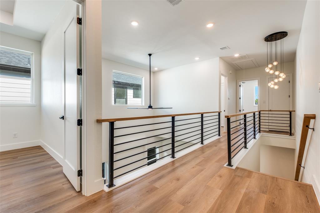 2424 Jeffries Street Dallas, TX 75215 - Photo 9 of 28 Hallway with an upstairs landing, recessed lighting, light wood-type flooring, and attic access