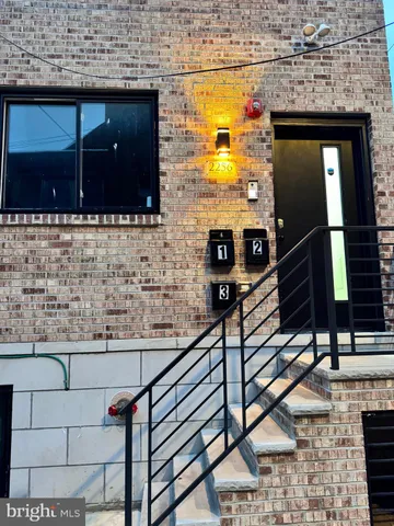a bathroom with a sink a mirror and shower