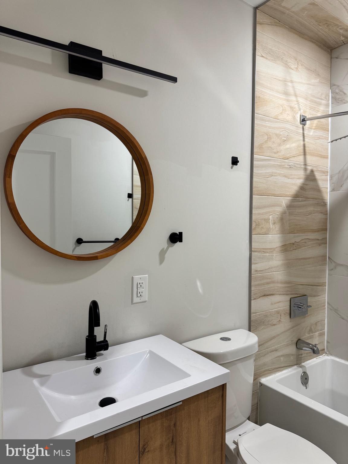 2256 North 9th Street, Unit 1 Philadelphia, PA 19133 - Photo 12 of 29 a bathroom with a sink and a mirror
