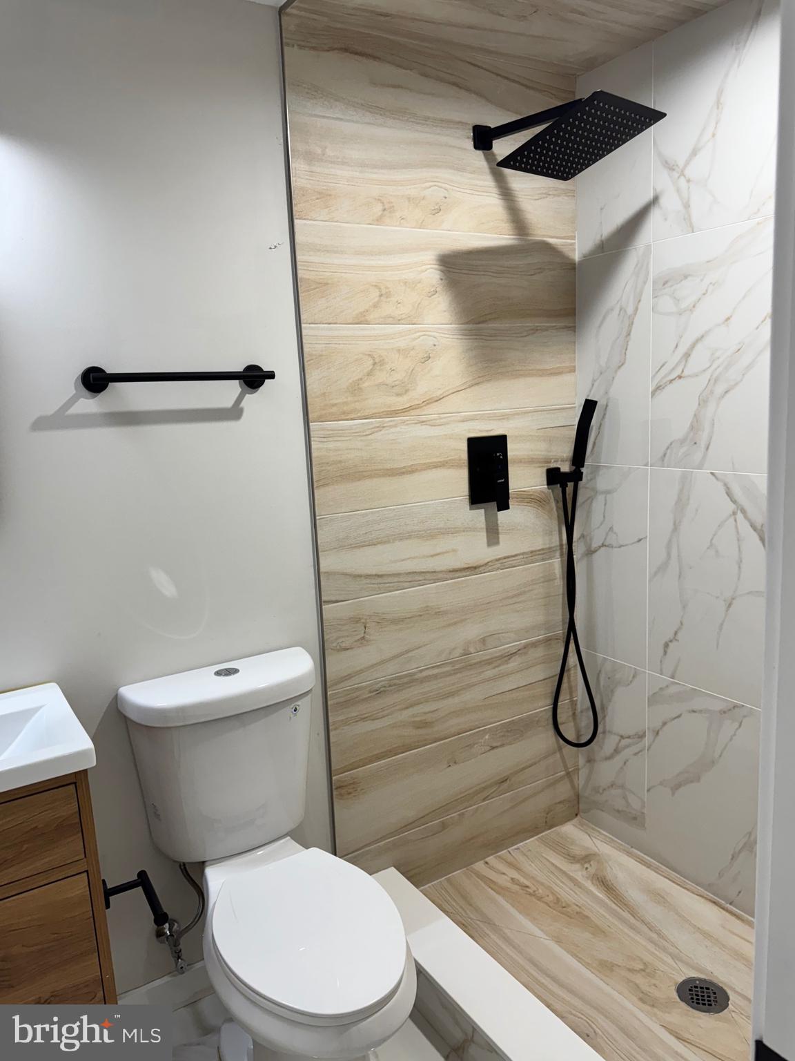 2256 North 9th Street, Unit 1 Philadelphia, PA 19133 - Photo 20 of 29 a white toilet sitting next to a bathroom sink